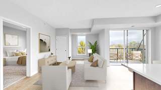A modern living room with a white sofa set and a wooden floor.