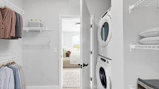 A laundry room with a washer and dryer.