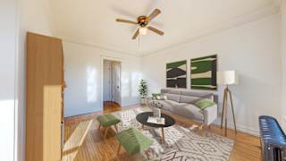 a living room with white walls and a ceiling fan at The Park Apartments, Minnesota
