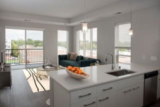 Joel 1 bedroom, kitchen bar for seating and living room areaat Urban Park I and II Apartments, St Louis Park, MN, 55426
