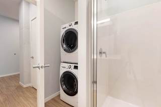 A white washing machine and dryer in a small laundry room.