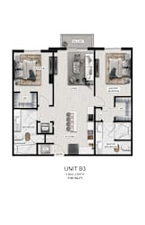 A floor plan of a 2-bedroom, 2-bath unit with a living room, dining room, kitchen, and laundry area.