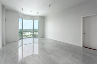 A room with a large window overlooking a beach at Clayton on the Park Apartments, Clayton, MO, 63105