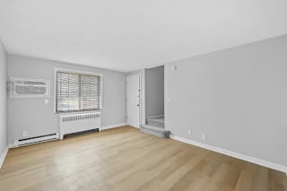 A room with a window and a radiator on the wall at Huntley Ridge Apartments, Ohio