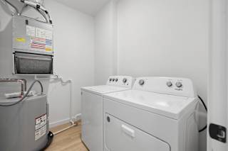 A washing machine and dryer in a small laundry room.