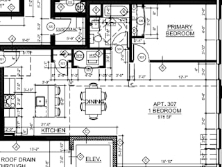 A floor plan shows a primary bedroom, a kitchen, and an apartment number.