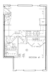 A floor plan of a small apartment with a bedroom, bathroom, and closet.