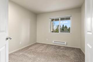 A room with a window and a door.