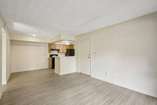 A room with a white ceiling and a wooden floor.