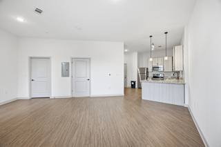 A kitchen area with a counter and cabinets.