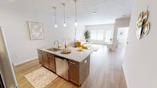 A kitchen with a sink, refrigerator at The Landing Apartments, Avon, IN