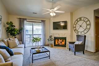 Living Area With TV And Fireplace at The Pointe, LaVista, NE, 68128