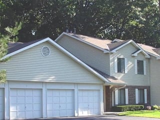 A house with a garage and a window.