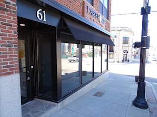The exterior of a building with the number 61 on it.