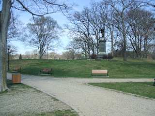 Monument in park with walking paths and benches at Bostonian Shoe Lofts Apartments, Massachusetts