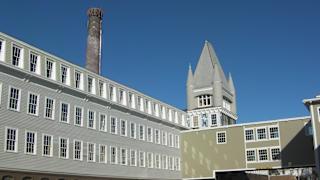 Historic mill building with chimney at Bostonian Shoe Lofts Apartments, Massachusetts, 02382