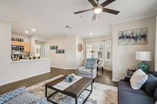 A living room with a grey couch and a coffee table.