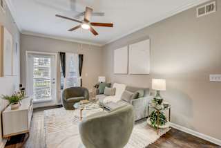 a living room with a couch and a ceiling fan at Artisan Apartments & Shops, Austin, Texas, 78729