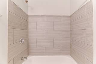Large Soaking Tub In Master Bathroom at Johnson Legacy Apartments, Milwaukee, WI, 53223