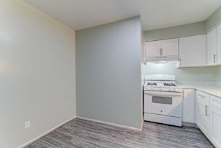 Modern Kitchen With Stainless Steel Appliances And Double Door Refrigerators at Johnson Legacy Apartments, Milwaukee, WI