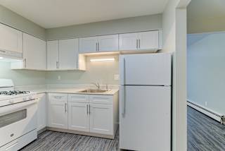 Modern Kitchen With Custom Cabinet at Johnson Legacy Apartments, Milwaukee, WI, 53223