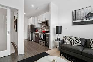 a living room with a couch and a table at Link Apartments® Mint Street, Charlotte, North Carolina