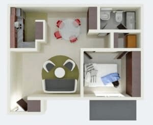 a bedroom with a bed and a desk in a room