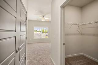 an empty closet with a window and a ceiling fan at The Augustan, Georgia