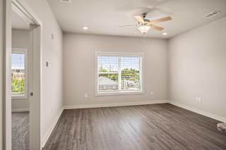 an empty living room with a window at The Augustan, Georgia, 30901