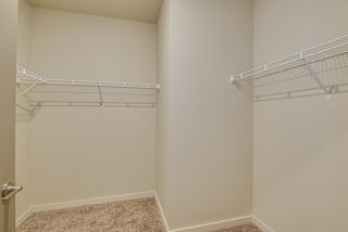 an empty closet with two shelves in a room with a door at The Augustan, Augusta, 30901