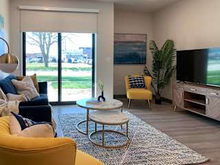 a living room with a couch and a table and a tv