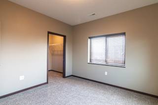 Bedroom with attached walk in closet at 360 at Jordan West