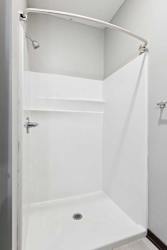 A bathroom with a walk-in shower.