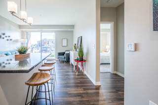 An open layout with view of living room from a modern kitchen.