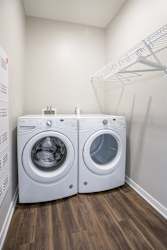 Front loading washer and dryer in a laundry room