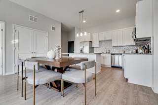 Furnished dining area off of the luxury kitchen in two bedroom apartment in Woodbury MN 55125