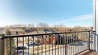a balcony with a metal railing and a view of the neighboring Villas at Wilderness Ridge
