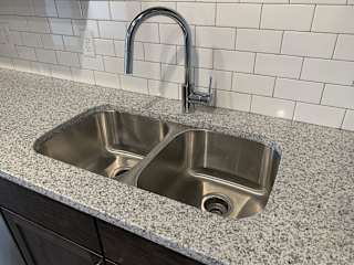 Stainless steel undermount sink with a chrome faucet