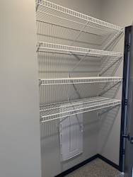 Spacious walk-in closet with shelving in peace floorplan at Haven at Uptown