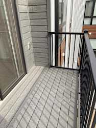 Spacious deck with a view sliding door and screen door entry