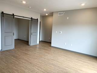 Large open living dining area with den