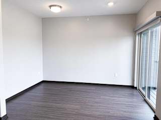 Open living and sleeping area in a studio floor plan at Haven at Uptown