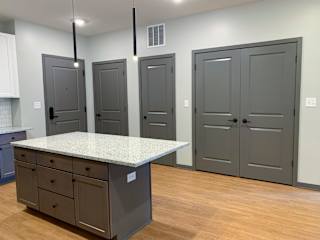 Luxury kitchen with matching stainless steel appliances and large granite counters at Haven at Uptown in Lincoln, Nebraska
