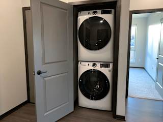 stacked washer and dryer in closet