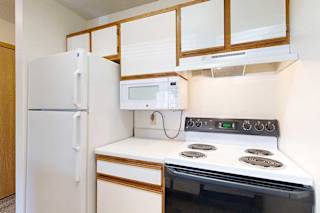 Kitchen appliances including refrigerator, microwave, and stove