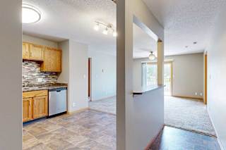 a view from the kitchen and living room from the front entry