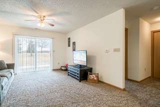 Interiors-Living room in 1-bedroom apartment with walkout patio