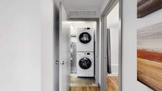 Full-size, front load, stacked washer and dryer is included in every floor plan at Midtown Crossing Apartments Omaha