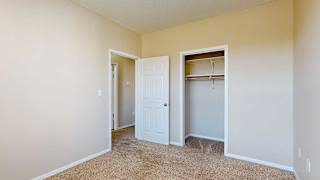 a bedroom with a wide walk-in closet