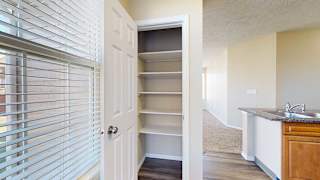 a kitchen pantry with built-in shelving